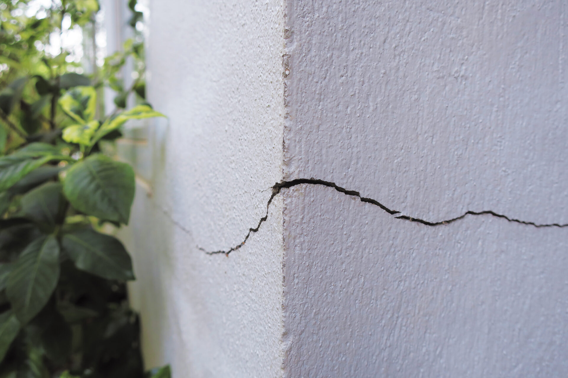 A customer's cracked concrete foundation due to bad excavation and collapsed ground.